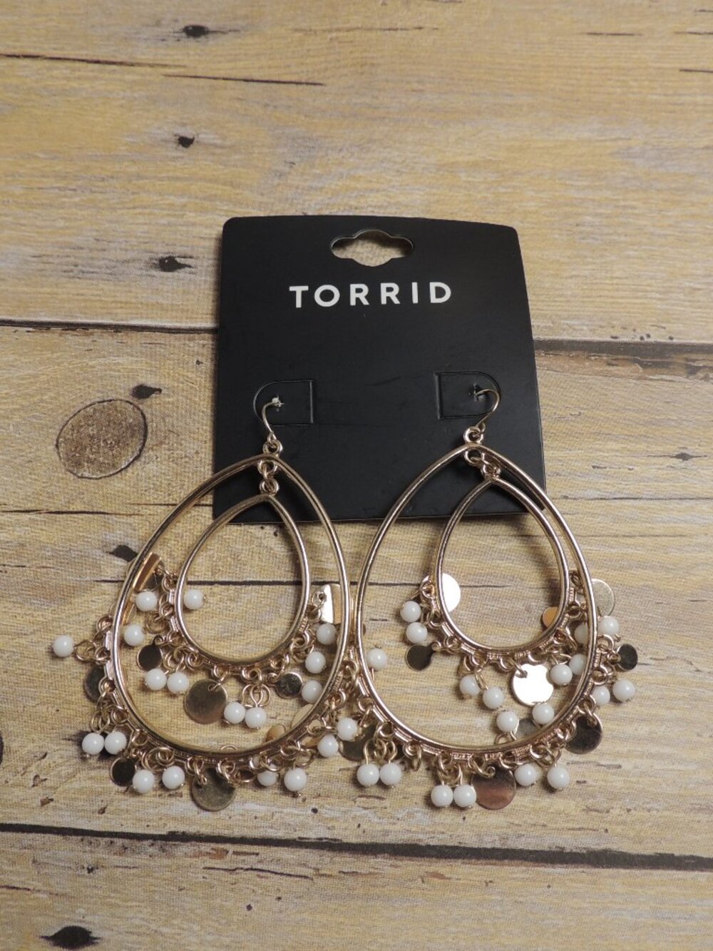Torrid gold toned teardrop earrings with white shaky beads NEW